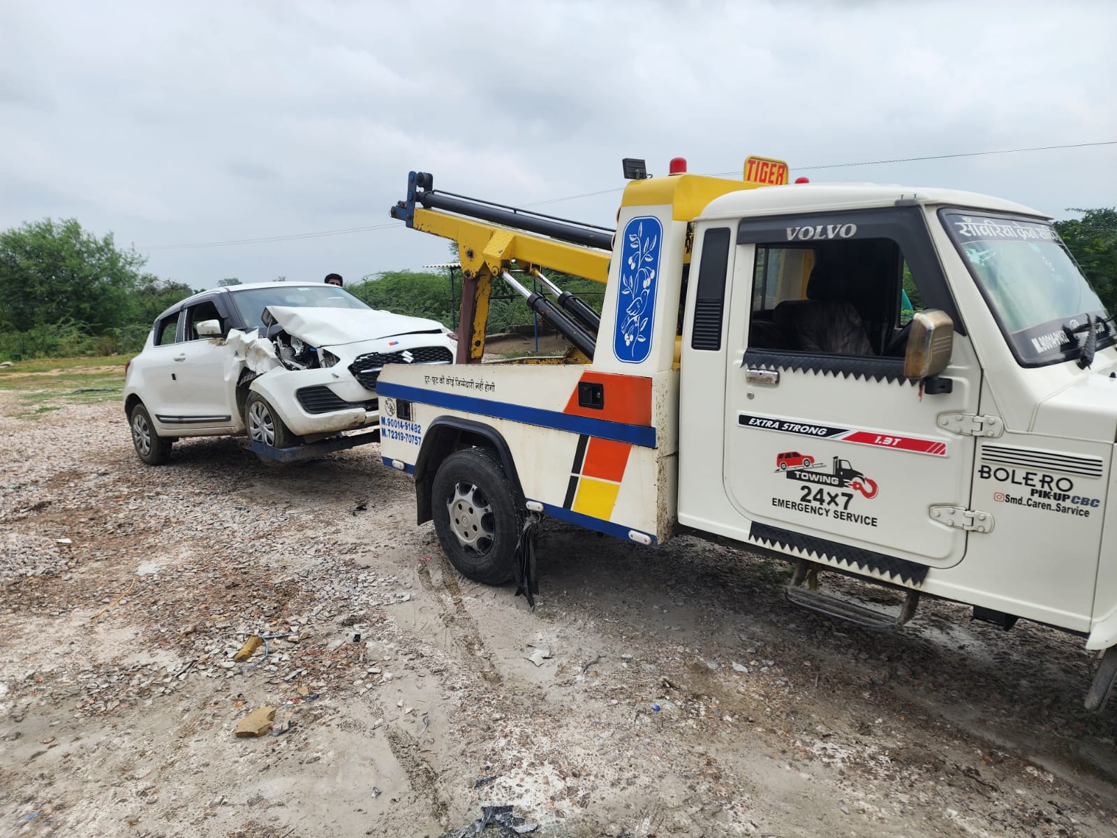 White SUV being recovered using a tow truck